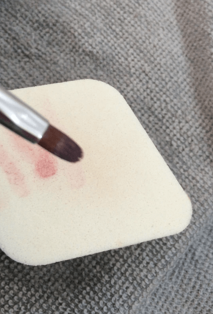 Cleansing Travel Size Brushes With A Sponge And MAC Brush Cleanser - Step 2 : Swipe The Bristles On The Soaked And Lathered Sponge